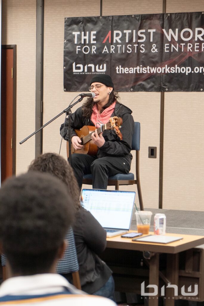 Musician Gabe Cedeira performs for the Artist Workshop panel.