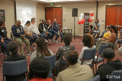 Panelist Harriet Duncan speaks to the members of the workshop alongside her fellow panelists A'Noelle Jackson, Shyan Selah, John Silva, Charles Newman, Kirkland Morris and Jon Stockton at The Artist Workshop: Career Day.