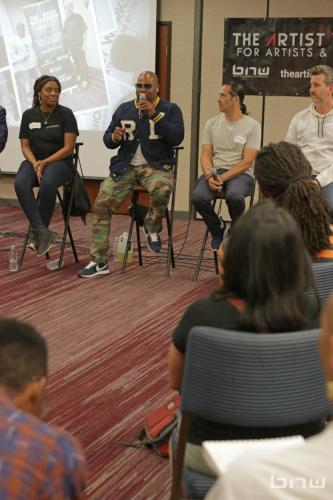 Panelist Shyan Selah speaks to the room of workshop members alongside A'Noelle Jackson, John Silva and Charles Newman at The Artist Workshop: Career Day.