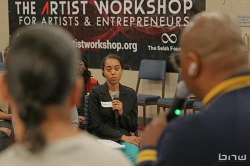 Workshop member Ayana listens to panelist Shyan share his insight at The Artist Workshop: Career Day.