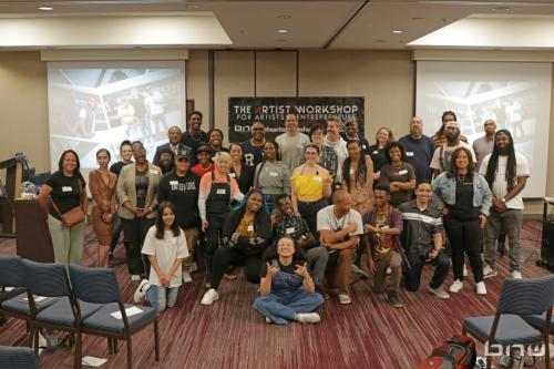 Workshop member and panelists all pose together for the final workshop of the first year of the Artist Workshop!