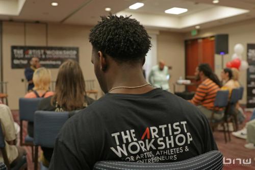 Workshop team member Muranga gets ready for the panel to begin at The Artist Workshop: Career Day