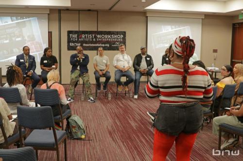Workshop member Shaflo asking the panelists a question about her music career at The Artist Workshop: Career Day