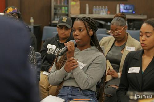 Workshop member Empress Ra asks a question to the panelists at The Artist Workshop: Career Day