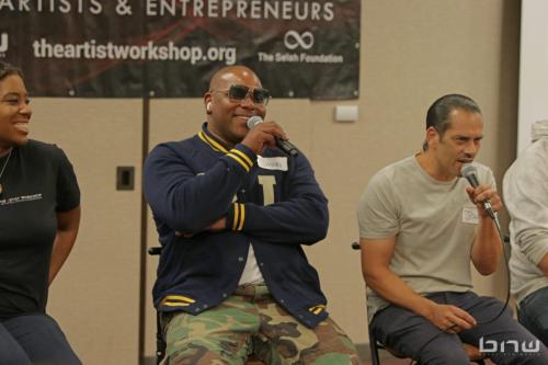 Panelist Shyan Selah speaks to the audience next to John Silva and A'Noelle Jackson at The Artist Workshop: Career Day