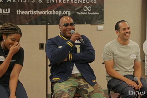 Panelist Shyan Selah laughs with John Silva and A'Noelle Jackson at The Artist Workshop: Career Day