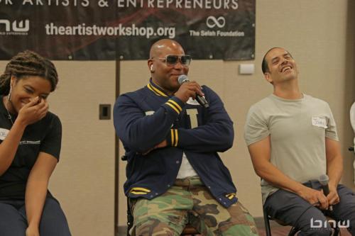 Panelist Shyan Selah laughs with John Silva and A'Noelle Jackson at The Artist Workshop: Career Day