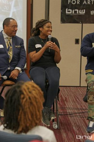 Panelist A'Noelle Jackson laughs next to Curtis Elerson at the Artist Workshop: Career Day