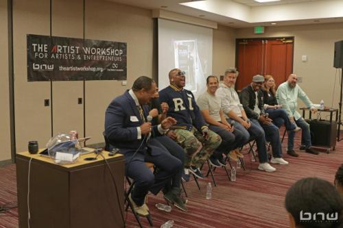 Panelists Curtis Elerson, A'Noelle Jackson, Shyan Selah, John Silva, Charles Newman, Kirkland Morris, Harriet Duncan and Jon Stockton all laugh together at The Artist Workshop: Career Day 