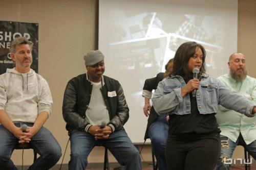 Event Producer Candice Richardson talks to the group members at The Artist Workshop: Career Day 