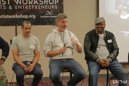 Panelist Charles Newman answers a question next to John Silva and Kirkland Morris at The Artist Workshop: Career Day