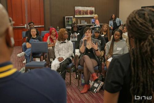 Workshop member Mel asks a question to the panelists at The Artist Workshop: Career Day 