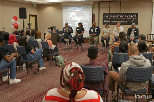 Panelist Curtis Elerson answers a question alongside A'Noelle Jackson, Shyan Selah, John Silva, Charles Newman and Kirkland Morris at The Artist Workshop: Career Day 