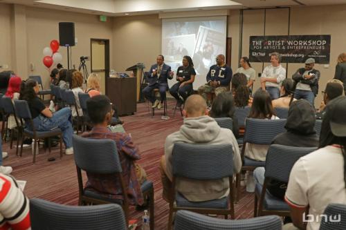 Panelist Curtis Elerson answers a question alongside A'Noelle Jackson, Shyan Selah, John Silva, Charles Newman and Kirkland Morris at The Artist Workshop: Career Day 