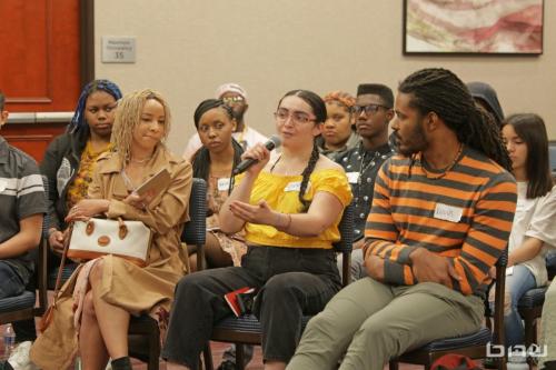 Workshop member Susana asks the panelists a question at The Artist Workshop: Career Day