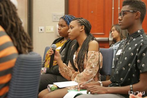 A workshop member listens to the panelists answer her question at The Artist Workshop: Career Day
