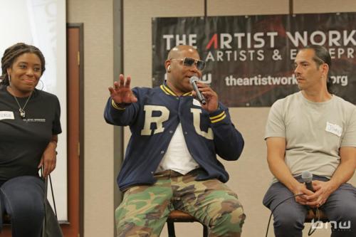 Panelist Shyan Selah answers a group member's question next to A'Noelle Jackson and John Silva at The Artist Workshop: Career Day