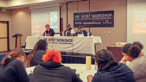 Alonzo Robinson speaks to the attendees alongside Charles Newman and Shyan Selah at The Artist Workshop: The Long Money Game.