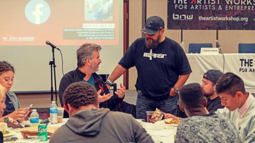 Alonzo Robinson and Charles Newman chat and eat with the workshop attendees at The Artist Workshop: The Long Money Game.