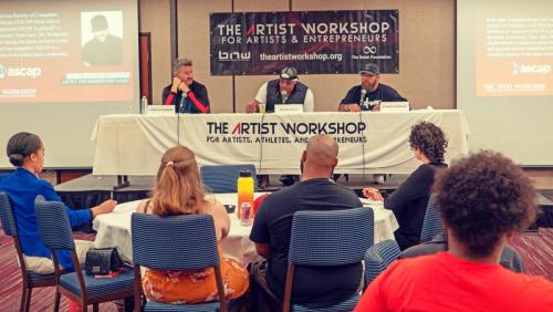 Shyan Selah speaks alongside Charles Newman and Alonzo Robinson to attendees at The Artist Workshop: The Long Money Game.