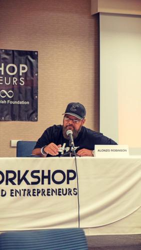 Panelist Alonzo Robinson speaks to the workshop members at The Artist Workshop: The Long Money Game.