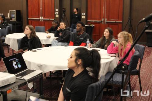 Lorna Pack sits with attendees at The Artist Workshop: Production 101 