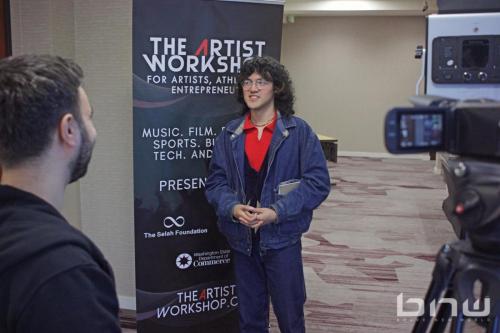 An attendee is interviewed by Video Director Larry Dominico at The Artist Workshop: The Actor.