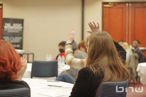 Attendees raise their hands at The Artist Workshop: The Actor.