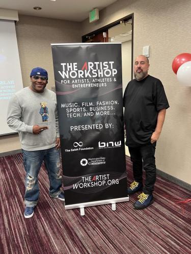 Founder Shyan Selah poses with Panelist Jon Stockton at The Artist Workshop: Making the Deal.